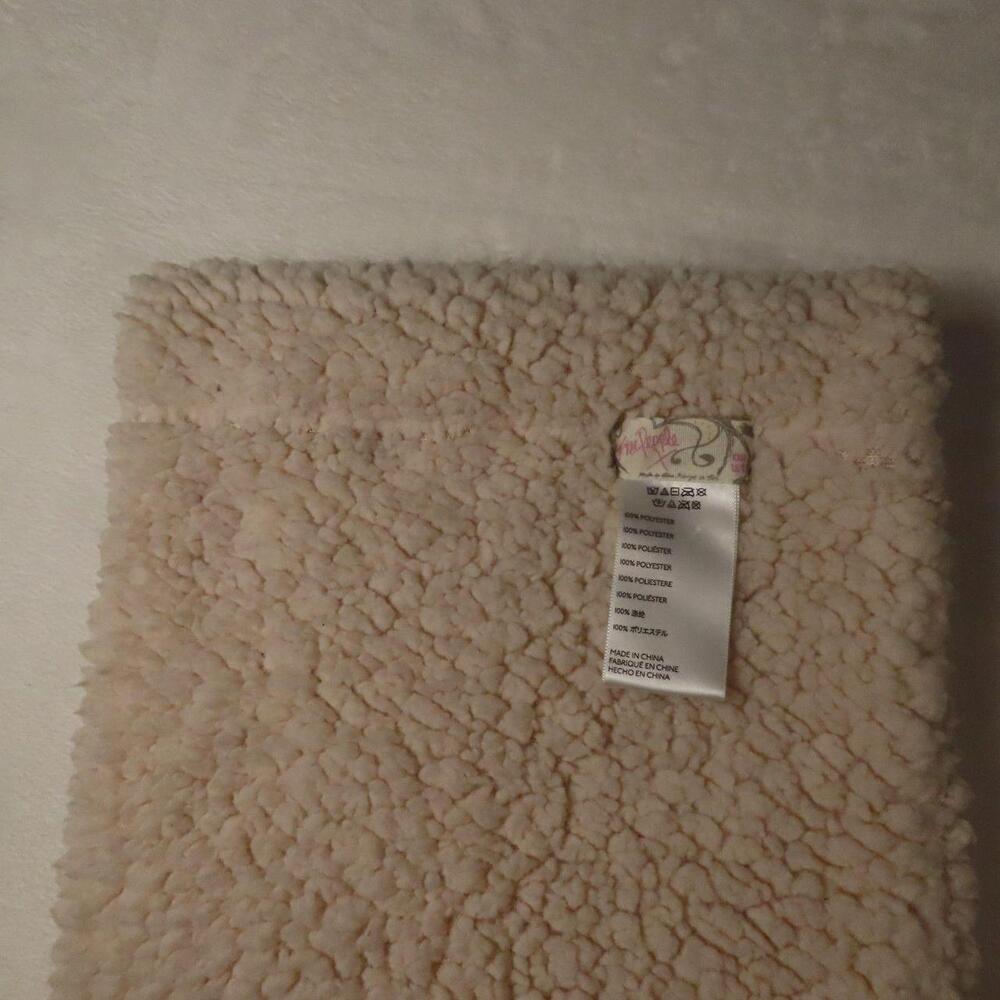 The Free People Sherpa Fleece Infinity Scarf in Cream Ivory is a stylish and coz